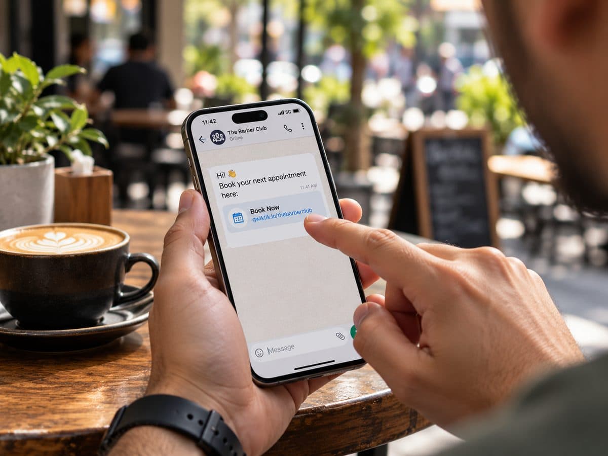 A customer at a café tapping a QwikTik booking link on their phone